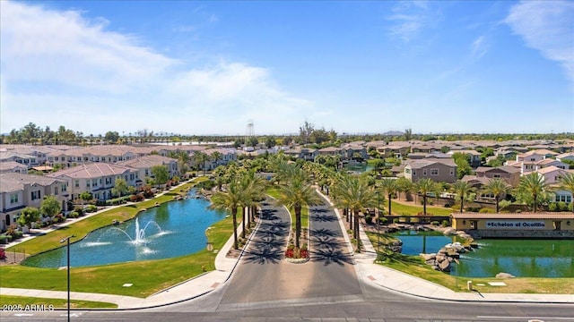 birds eye view of property featuring a residential view and a water view