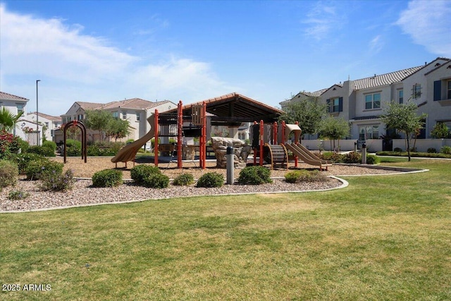 community playground with a yard and a residential view