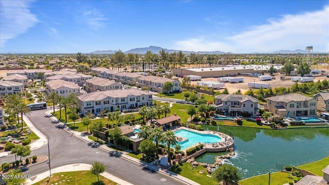 birds eye view of property with a mountain view and a residential view