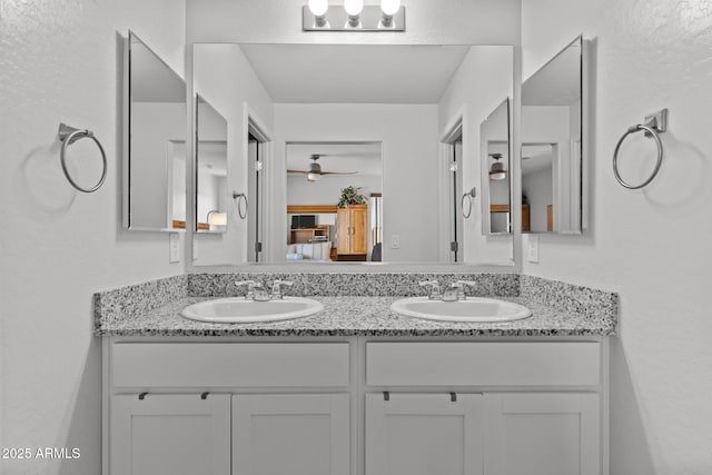 bathroom featuring vanity and ceiling fan