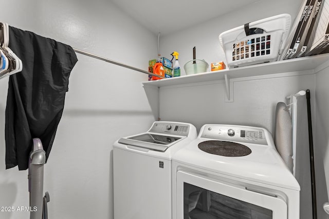 washroom featuring washer and dryer