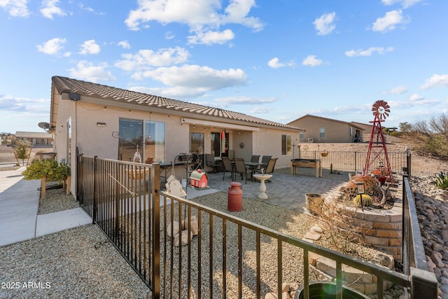 rear view of property with a patio area