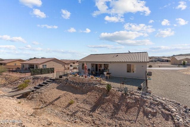 rear view of house featuring a patio area