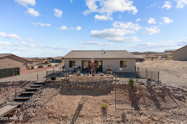 rear view of house with a patio