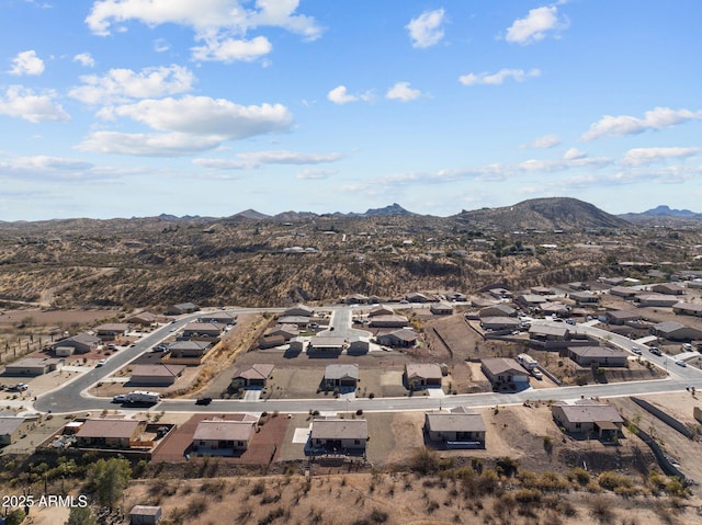 birds eye view of property featuring a mountain view