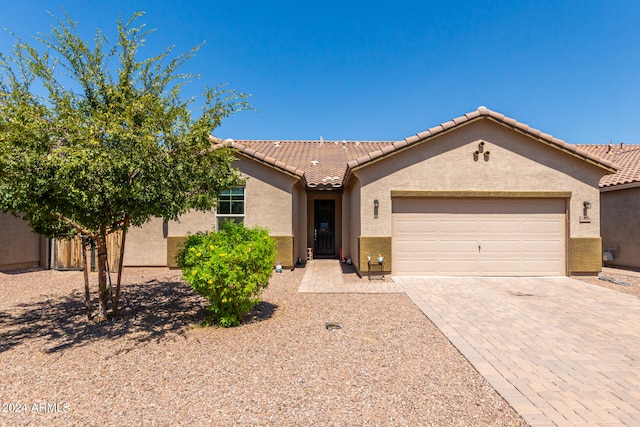 ranch-style home featuring a garage