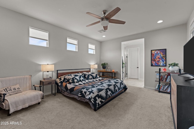 carpeted bedroom featuring visible vents, ceiling fan, multiple windows, and baseboards