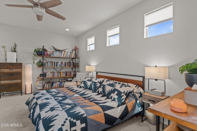 bedroom with a ceiling fan and carpet flooring