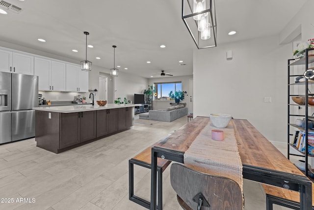 dining space featuring a ceiling fan, visible vents, and recessed lighting