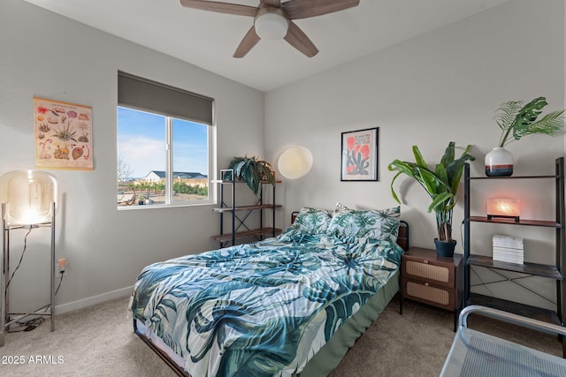bedroom featuring carpet floors, baseboards, and ceiling fan