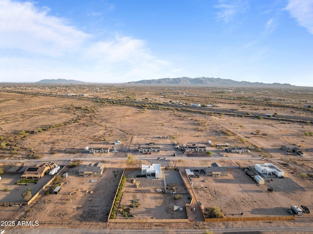 drone / aerial view with a mountain view and view of desert