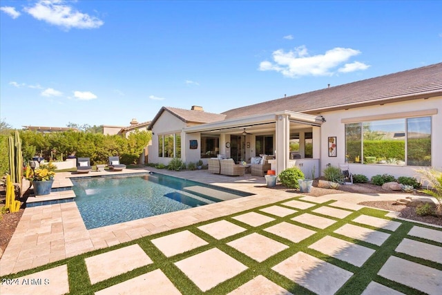 view of swimming pool featuring an outdoor living space, ceiling fan, and a patio