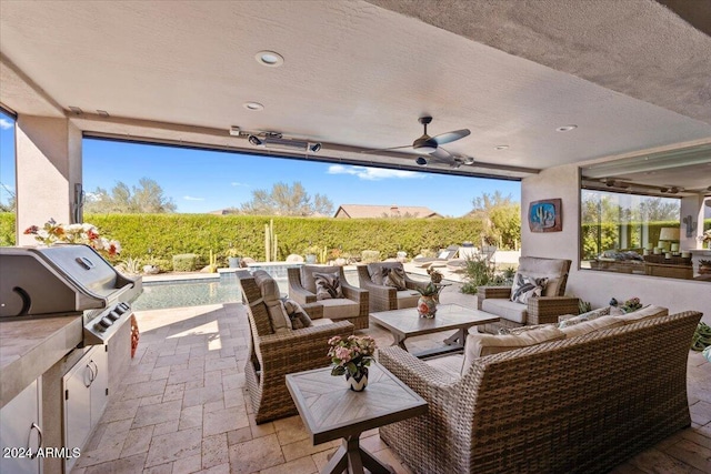 view of patio / terrace with outdoor lounge area, ceiling fan, area for grilling, and grilling area