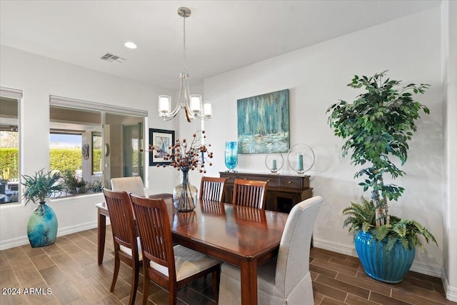 dining area featuring a chandelier