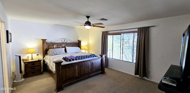 bedroom with a ceiling fan, light colored carpet, and visible vents