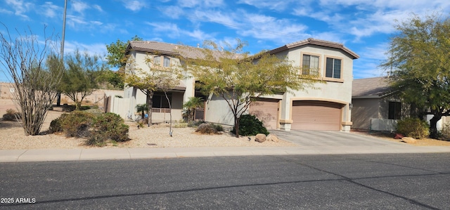 view of front of property featuring a tile roof, stucco siding, concrete driveway, and a garage