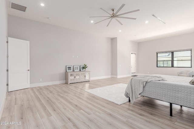 bedroom with ceiling fan and light hardwood / wood-style floors