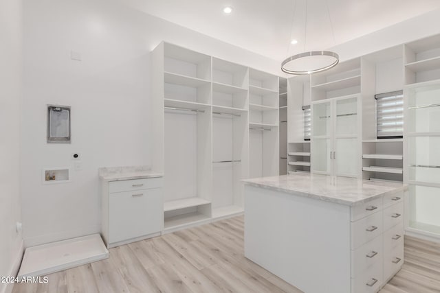 spacious closet featuring light wood-type flooring