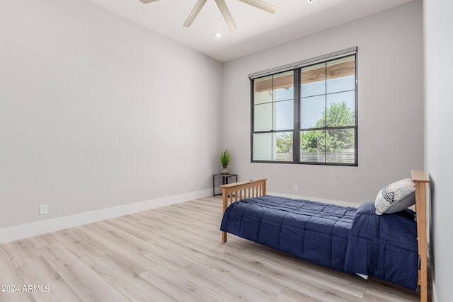 bedroom featuring ceiling fan and light wood-type flooring