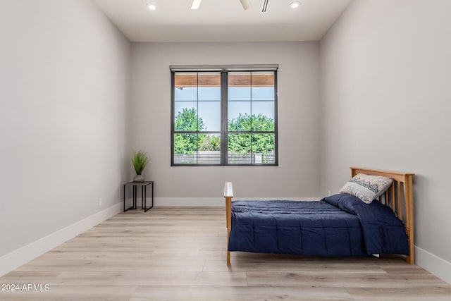 bedroom featuring ceiling fan and light hardwood / wood-style flooring