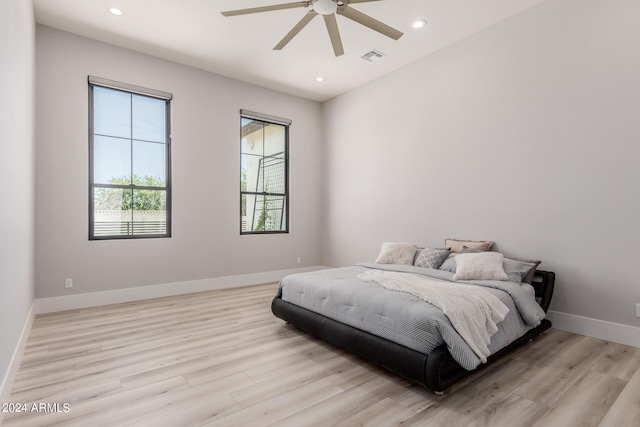 bedroom featuring light wood-type flooring and ceiling fan