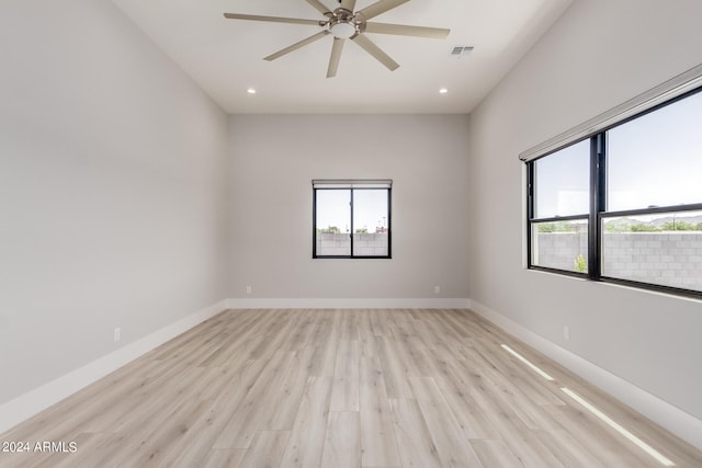 spare room featuring ceiling fan and light hardwood / wood-style floors