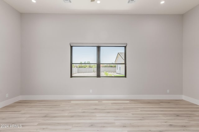 unfurnished room featuring light wood-type flooring