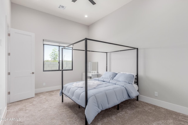 carpeted bedroom featuring lofted ceiling and ceiling fan