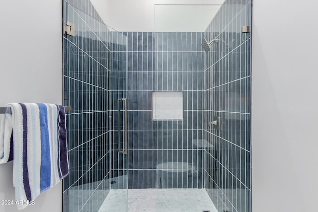 bathroom featuring an enclosed shower