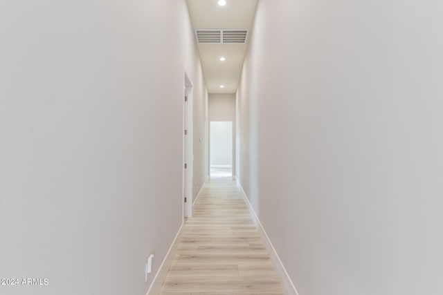 hall with light hardwood / wood-style floors