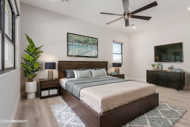 bedroom featuring ceiling fan and light hardwood / wood-style floors