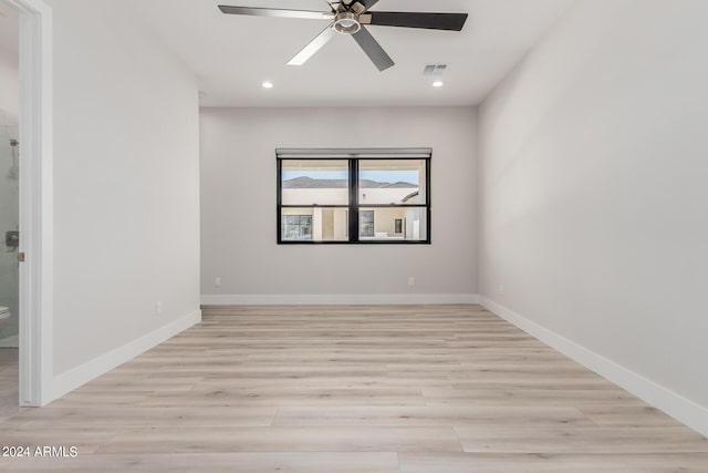 unfurnished room with light hardwood / wood-style floors and ceiling fan