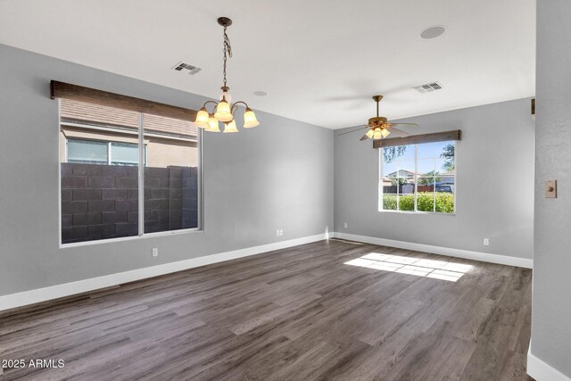 21616 E Calle De Flores, Queen Creek, AZ 85142 - unfurnished room with dark wood-style floors, ceiling fan with notable chandelier, visible vents, and baseboards