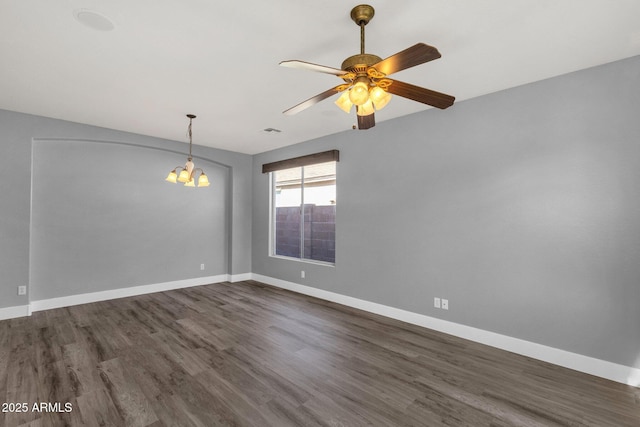 21616 E Calle De Flores, Queen Creek, AZ 85142 - unfurnished room with baseboards, visible vents, ceiling fan with notable chandelier, and dark wood-style flooring