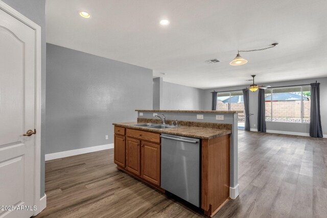 21616 E Calle De Flores, Queen Creek, AZ 85142 - kitchen with a sink, brown cabinetry, visible vents, baseboards, and stainless steel dishwasher