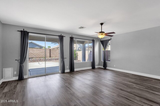 21616 E Calle De Flores, Queen Creek, AZ 85142 - spare room with baseboards, visible vents, wood finished floors, and ceiling fan