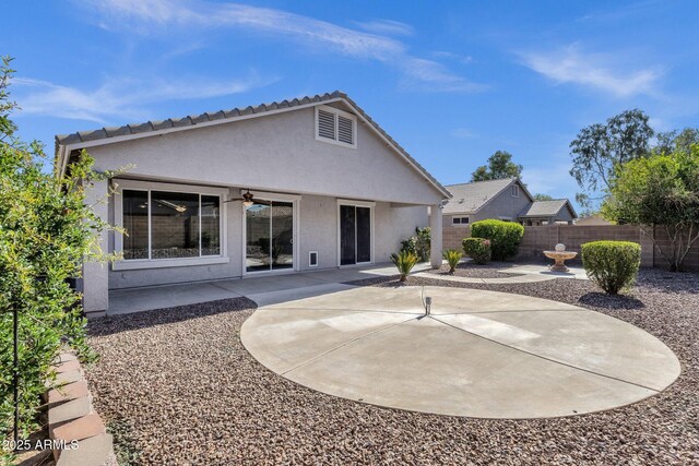 21616 E Calle De Flores, Queen Creek, AZ 85142 - rear view of property featuring stucco siding, ceiling fan, a patio, and a fenced backyard
