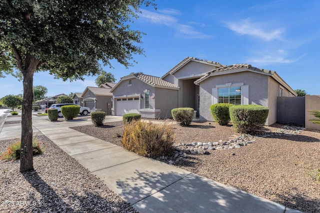 21616 E Calle De Flores, Queen Creek, AZ 85142 - ranch-style home featuring concrete driveway, a garage, stucco siding, and a tiled roof