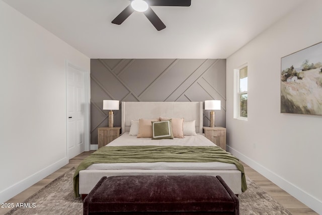 bedroom with hardwood / wood-style flooring and ceiling fan