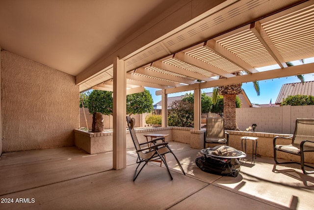 view of patio / terrace featuring a pergola and an outdoor fire pit