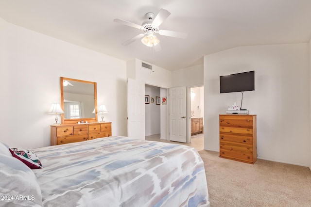 carpeted bedroom with connected bathroom, ceiling fan, and vaulted ceiling