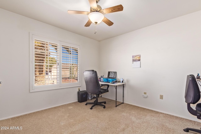 office space with ceiling fan and light colored carpet