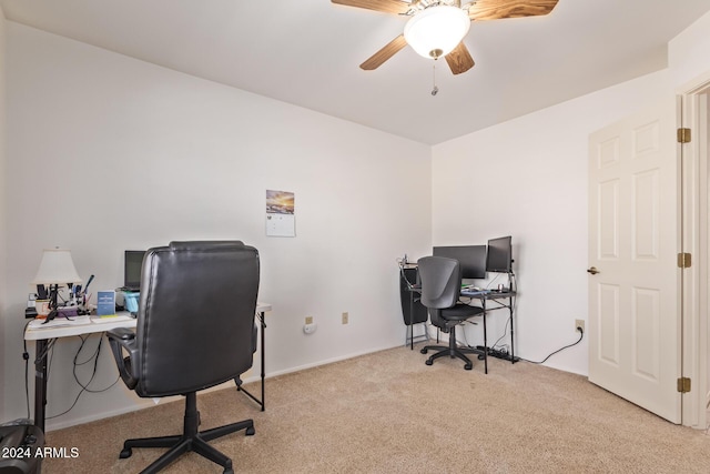 carpeted office with ceiling fan