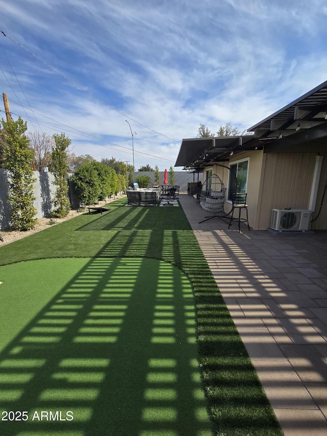 1954 E Nielson Ave, Mesa, AZ 85204 - view of yard featuring a patio area, ac unit, and an area to practice putting