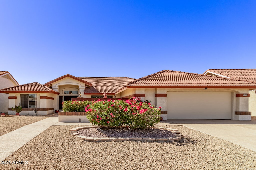 mediterranean / spanish-style house featuring a garage