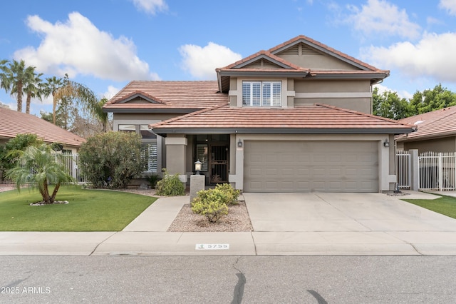 traditional-style house with a front yard, fence, driveway, stucco siding, and a tile roof