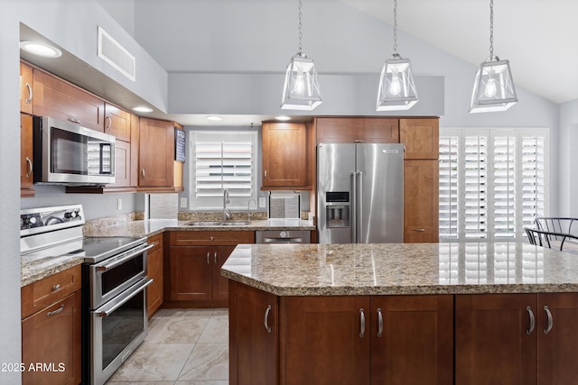 5755 W Harrison St, Chandler, AZ 85226 - kitchen featuring lofted ceiling, visible vents, appliances with stainless steel finishes, and a sink