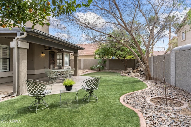 5755 W Harrison St, Chandler, AZ 85226 - view of yard featuring a fenced backyard, a ceiling fan, and a patio area