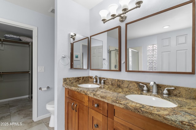 5755 W Harrison St, Chandler, AZ 85226 - full bath with double vanity, a spacious closet, toilet, and a sink