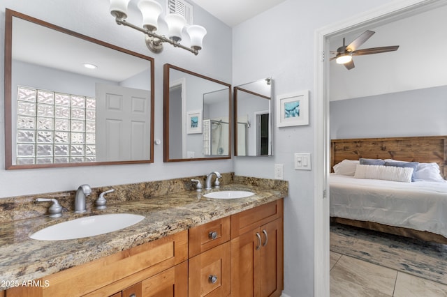 5755 W Harrison St, Chandler, AZ 85226 - bathroom featuring double vanity, marble finish floor, ceiling fan, and a sink